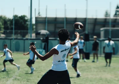 Built 2 Last Sports: Football player with ball.