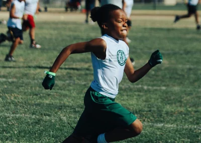 Built 2 Last Sports: Football player running.