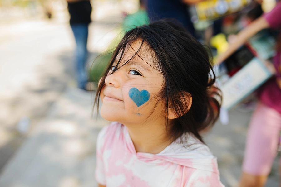 Little Girl Little girl with heart face painting.