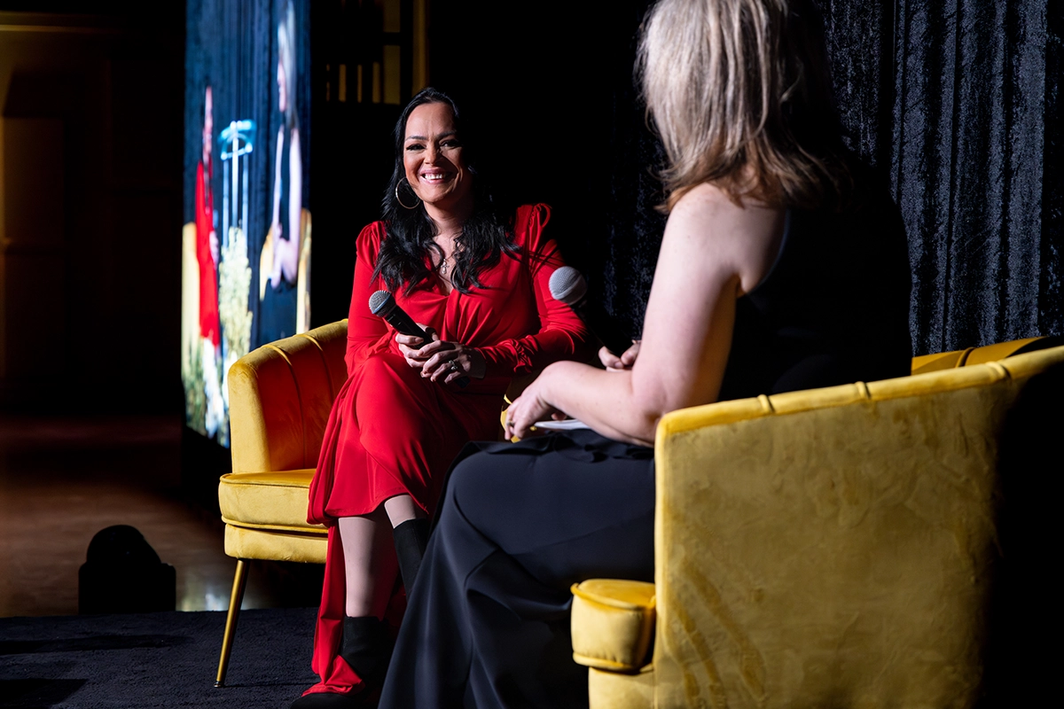 Speaker on stage during a live interview at the Bakersfield Mayor’s Ball benefiting CityServe.