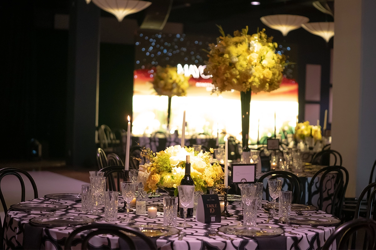 Decorated table with floral centerpiece and candles at the Bakersfield Mayor’s Ball.